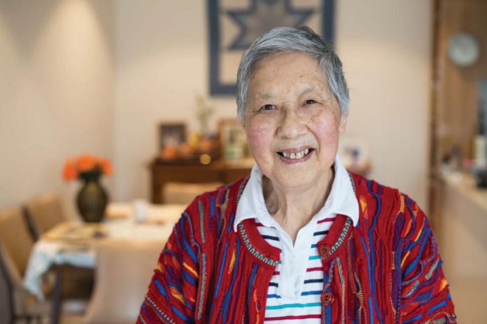 Portrait of elderly Chinese lady sitting in her house