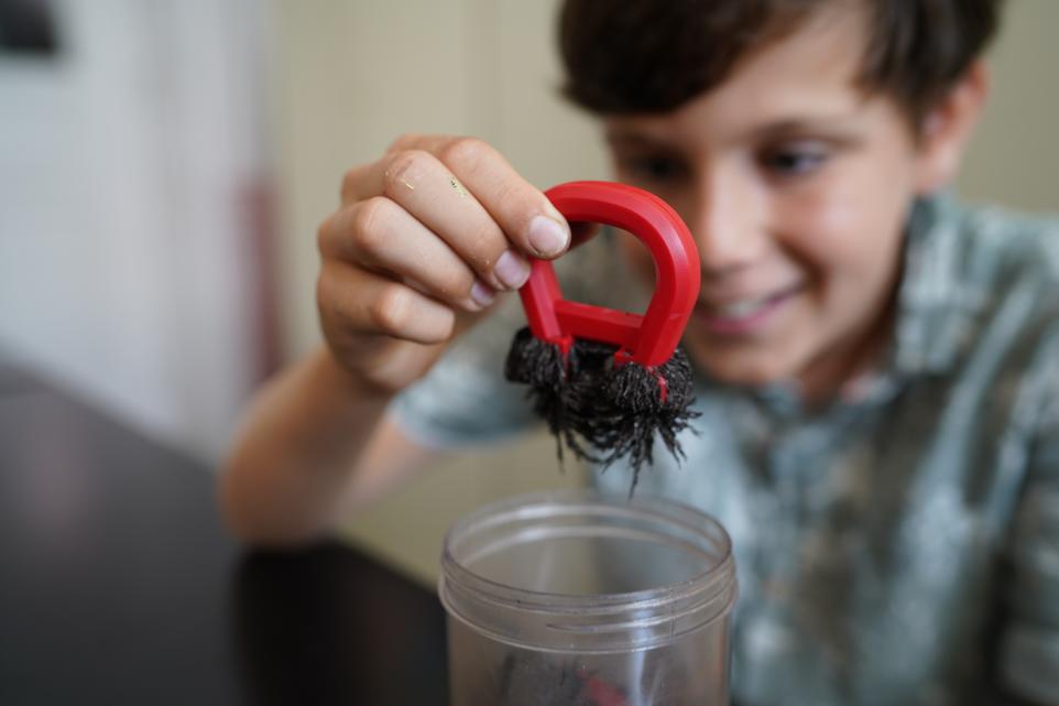 child holding a magnet