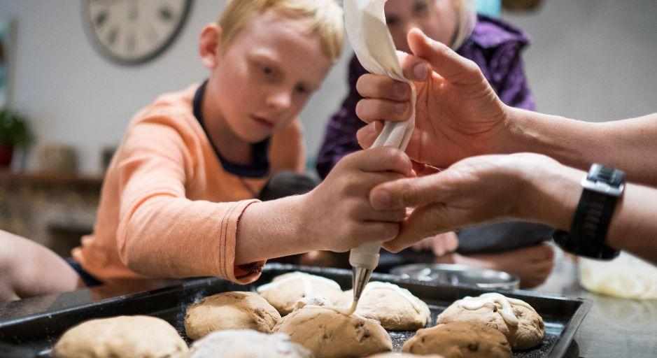 Children making hot cross buns