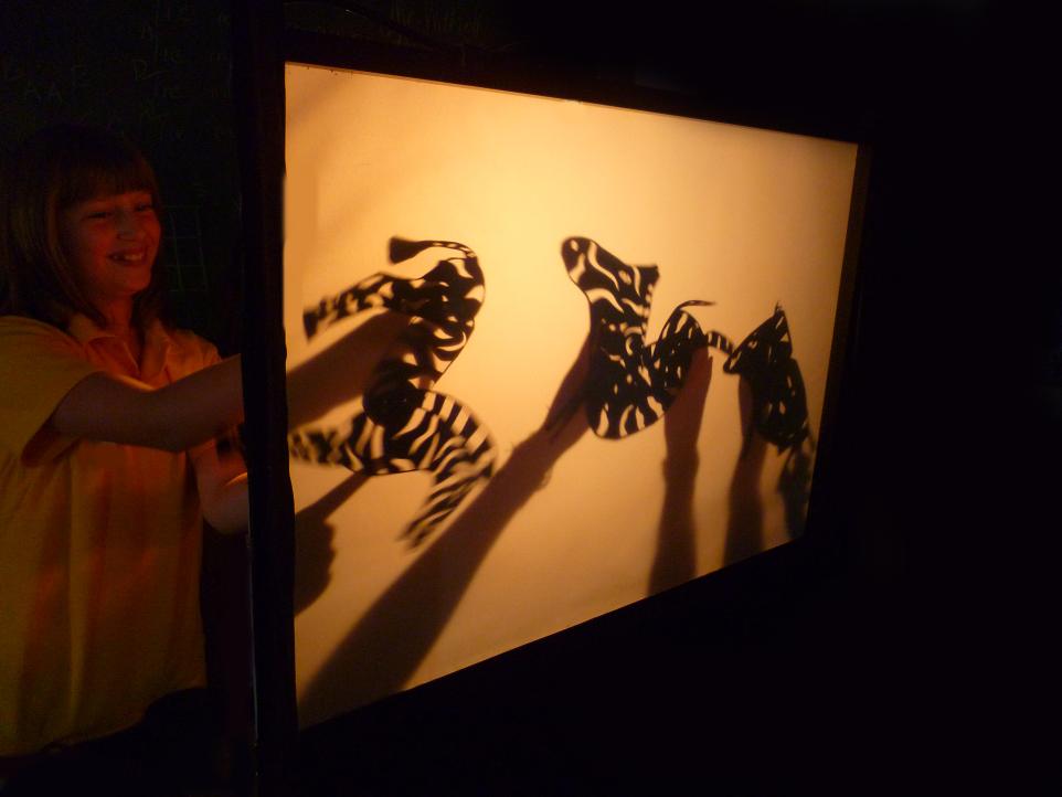 Child with zebra shadow puppets workshop with Jenny Ellis