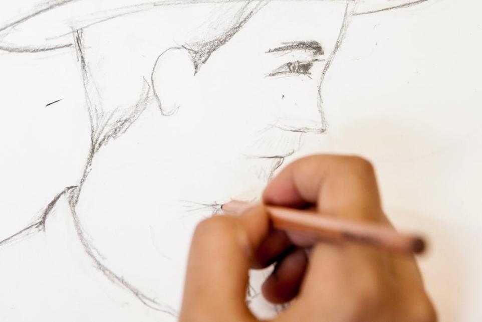 drawing portrait in grey pencil 