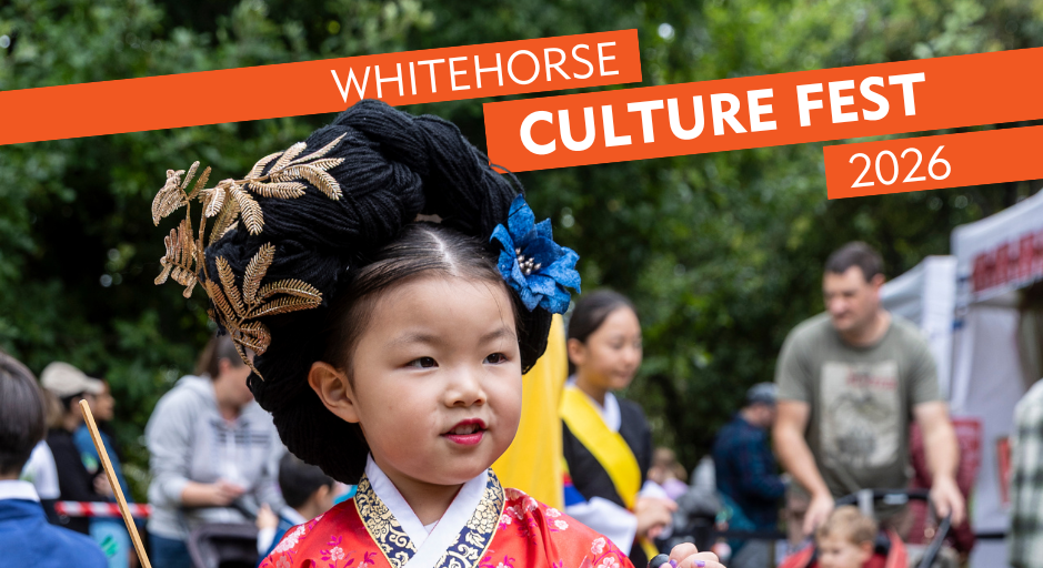 Young girl in traditional Korean clothing looking to the right of camera