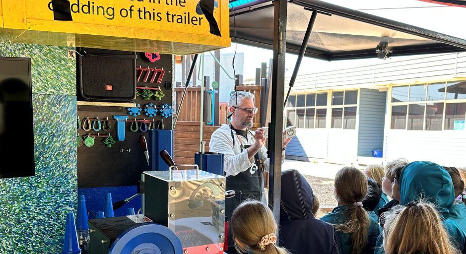 Rustie the Rethink Recycle Art truck demonstration to kids 