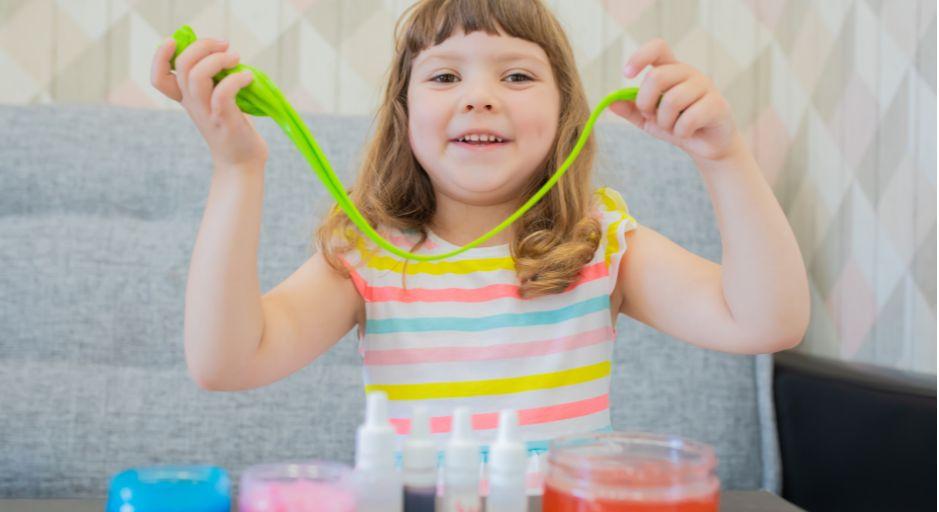 child with colourful slime 