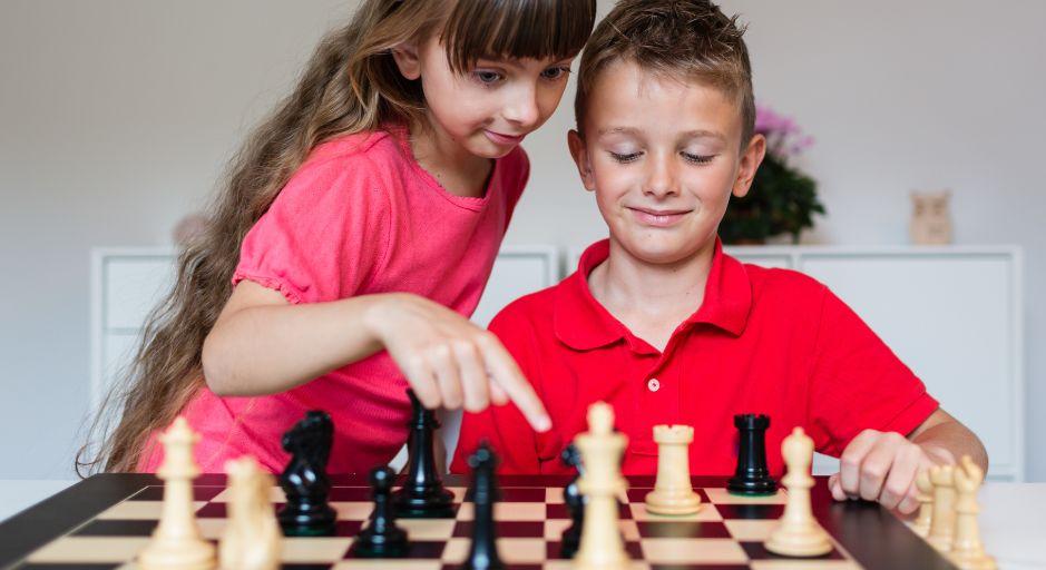 children playing board game together