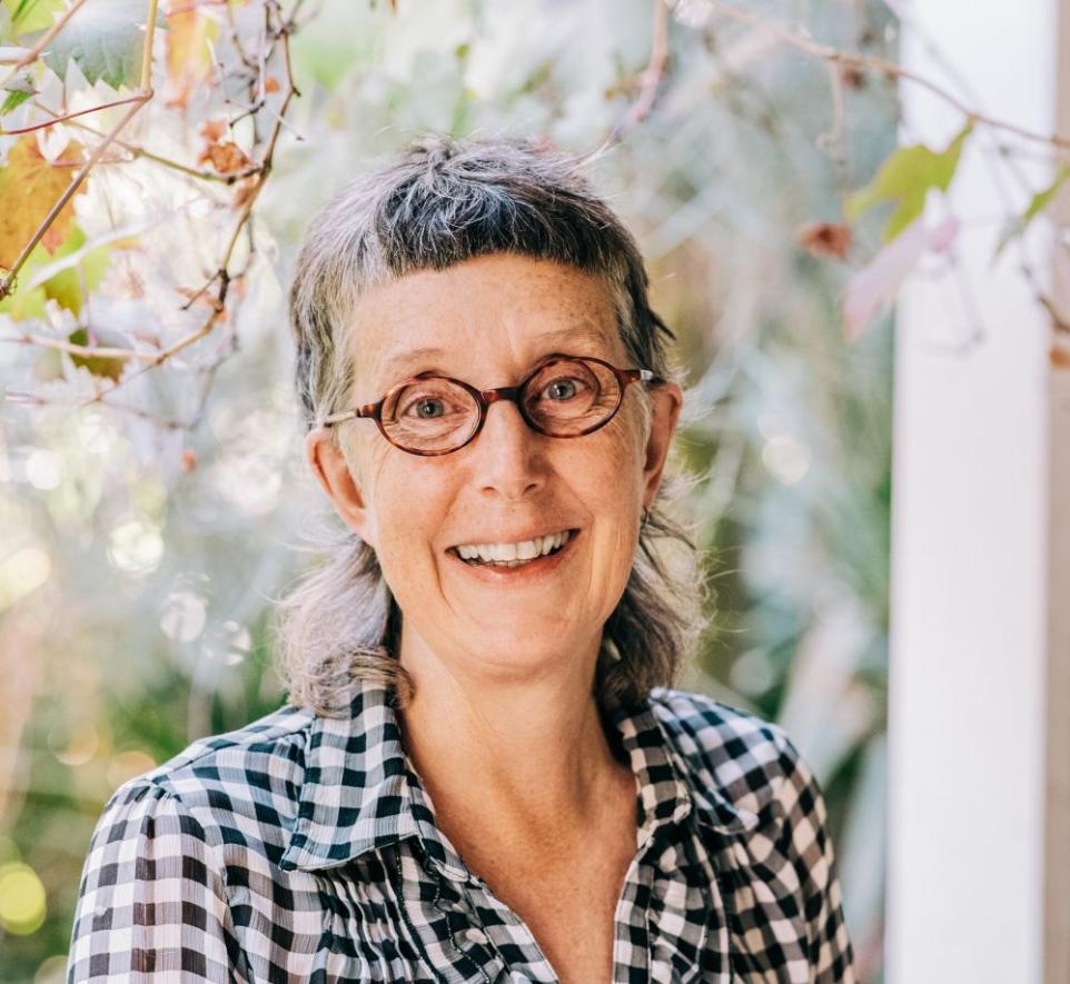 Portrait of a woman in a check shirt.
