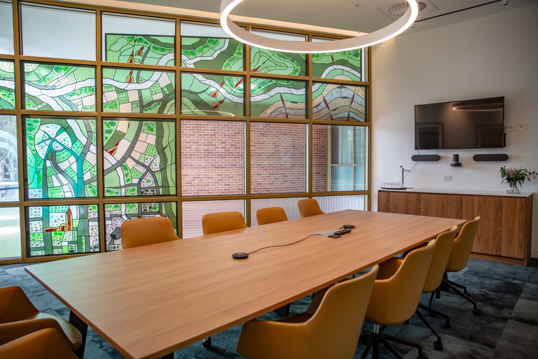 leadlight filled boardroom with chairs