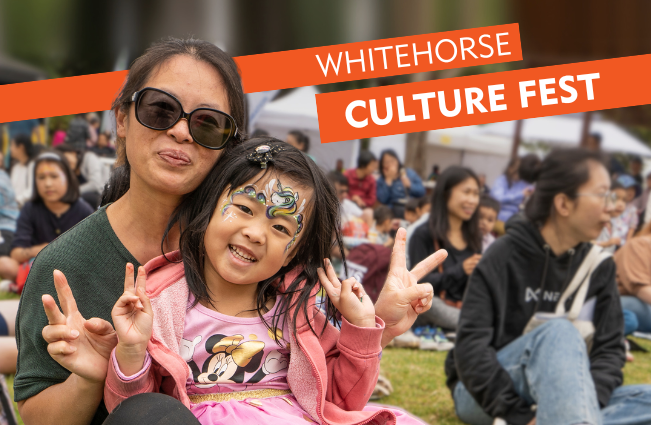 Mother and daughter smiling at the camera with the words Culture Fest at the top of the image