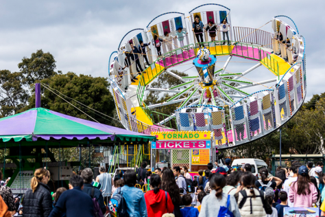 Wide shot of carnival ride at a festival 