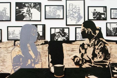 Artist rendering of two girls talking in a cafe