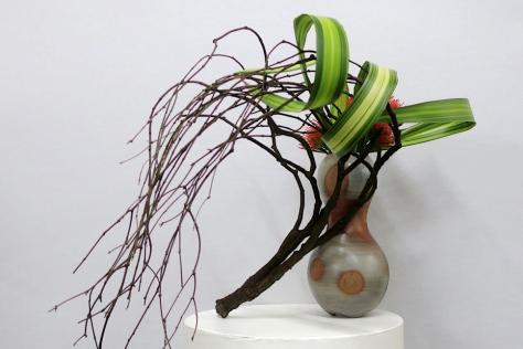 Flower arrangement with a windswept branch