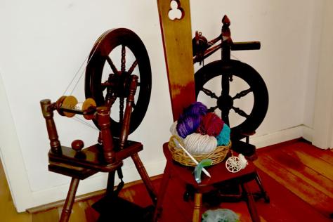 Photo of spinning wheels and yarn