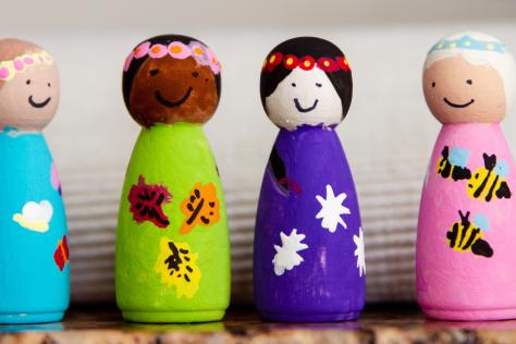 painted wooden peg people