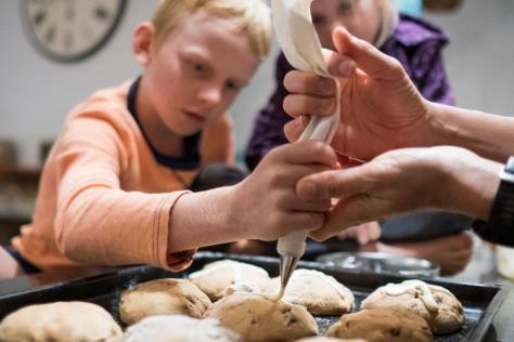 Children making hot cross buns