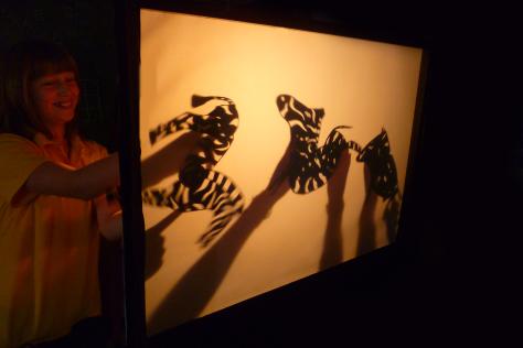 Child with zebra shadow puppets workshop with Jenny Ellis