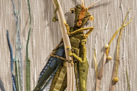 Grasshopper made from a man's tie and zippers