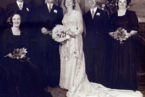 Black and white photograph of a wedding party in 1950.