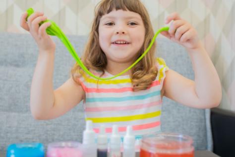 child with colourful slime 