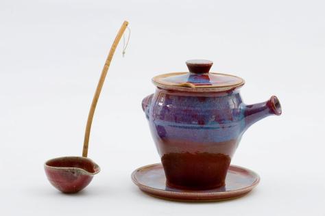 Artist made glazed ceramic soup ladle and tureen with spout.