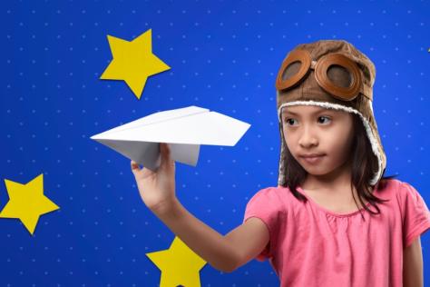 child with paper plane