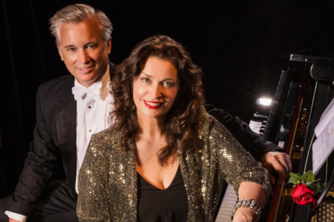 Ian and Michelle sitting next to piano