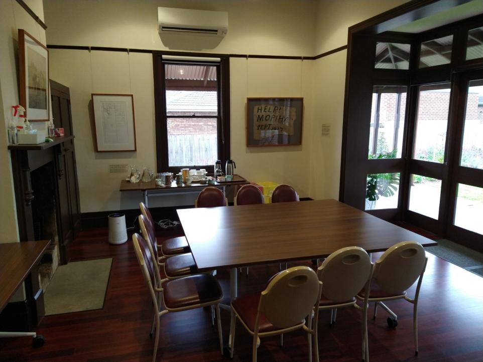 Mountain View room with square table and nine chairs set up with screen