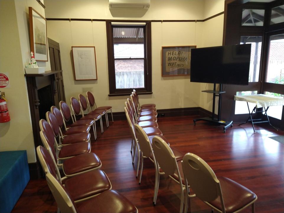 Mountain View room in theatre style room set up with screen