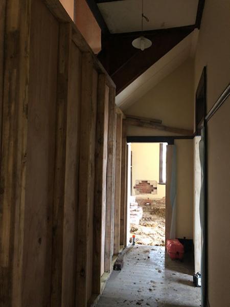 Inside hallway of house with floor removed